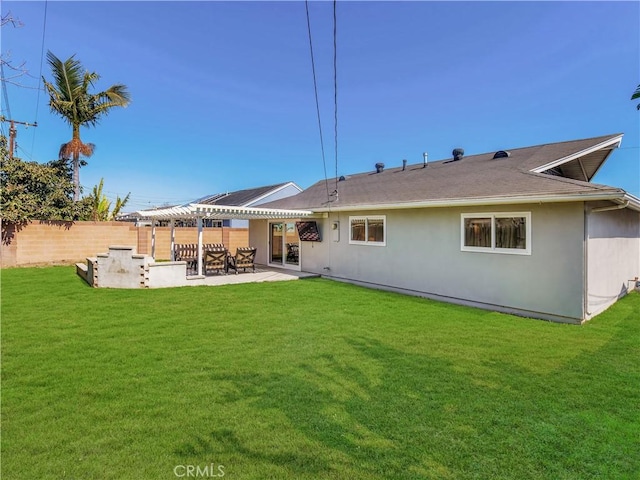 rear view of property with a patio, fence, a pergola, and a yard