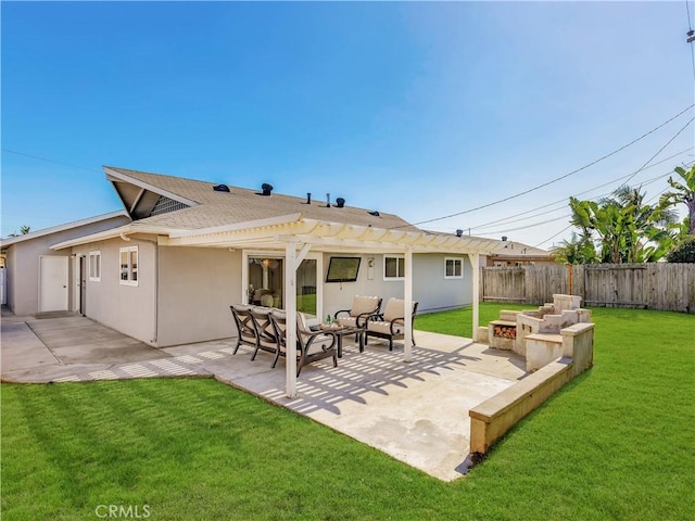 rear view of house featuring a lawn, an outdoor living space with a fire pit, a patio, fence, and stucco siding