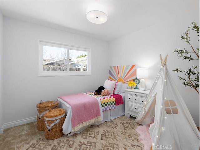 carpeted bedroom with baseboards