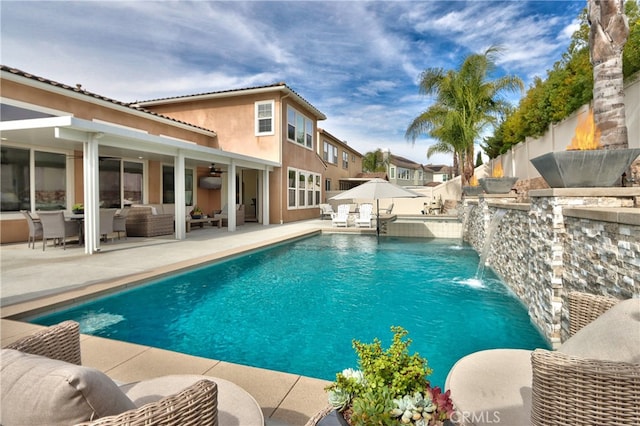 pool featuring an outdoor hangout area, ceiling fan, a patio area, and fence