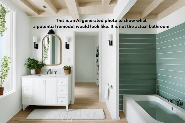 bathroom with vanity, a tub to relax in, wood finished floors, and beam ceiling