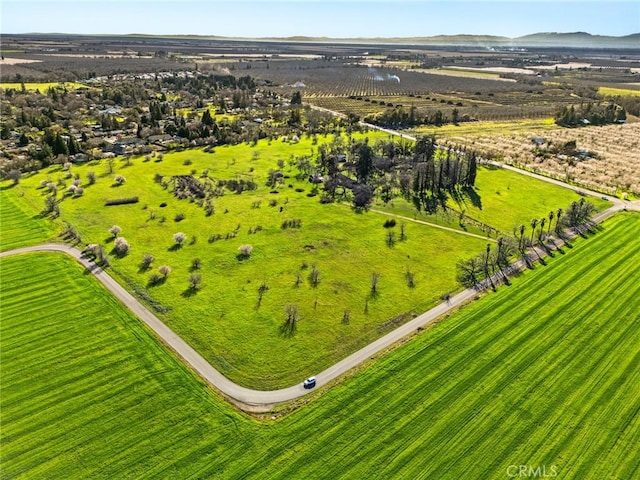 birds eye view of property with a rural view