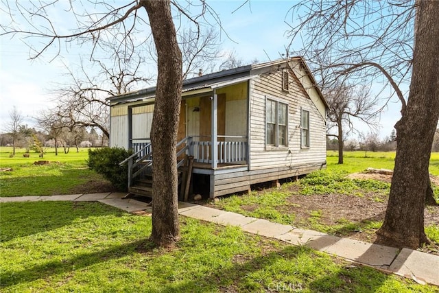 view of front of home with a front lawn and a porch