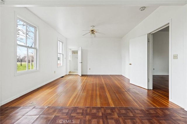 unfurnished living room with a ceiling fan and parquet flooring