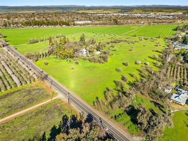 birds eye view of property featuring a rural view