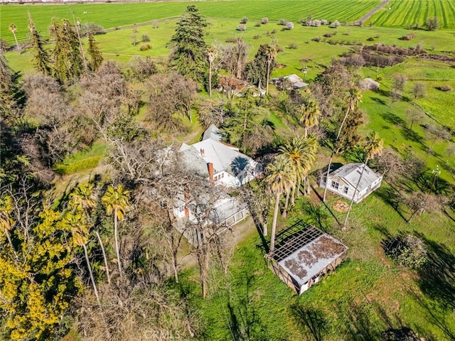 birds eye view of property with a rural view