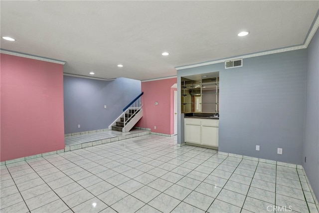 unfurnished room with crown molding, light tile patterned floors, recessed lighting, visible vents, and stairs