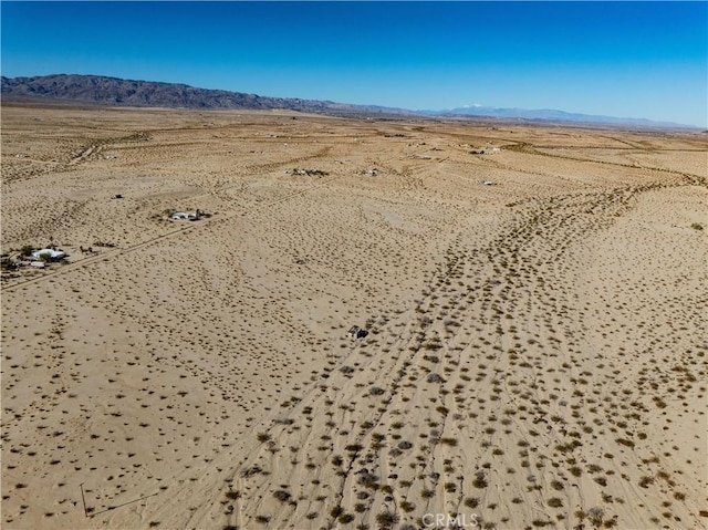 drone / aerial view with a mountain view and a desert view