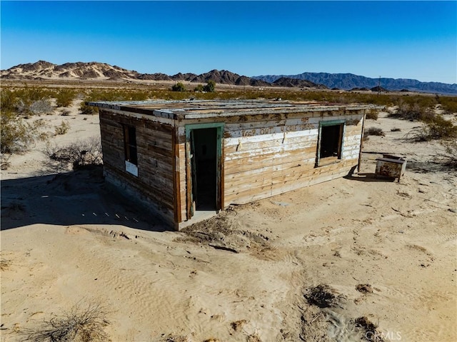 view of outbuilding with a mountain view