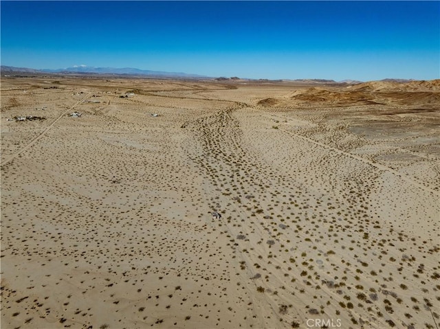 drone / aerial view with a desert view and a mountain view