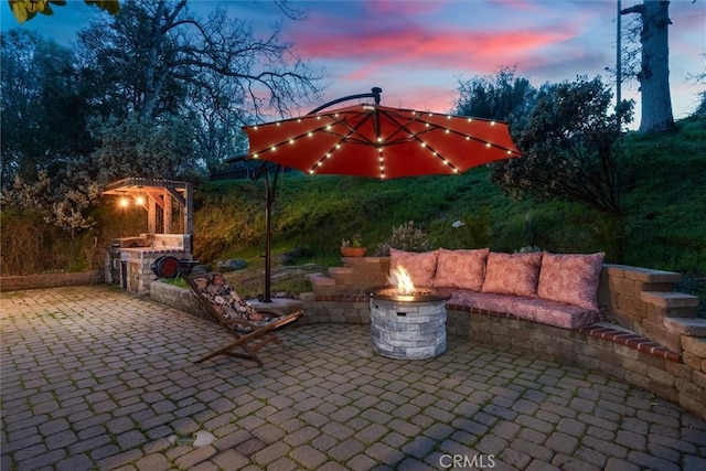 view of patio / terrace featuring a fire pit