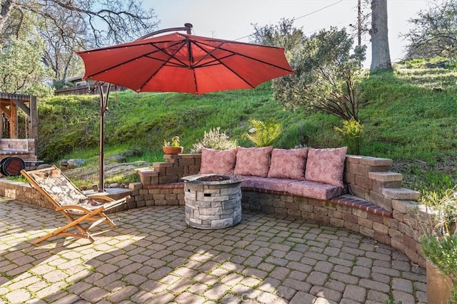 view of patio / terrace featuring a fire pit