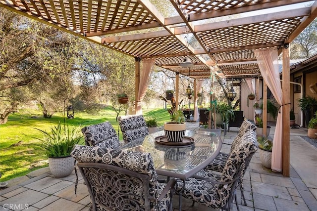 view of patio / terrace featuring outdoor dining area and a pergola