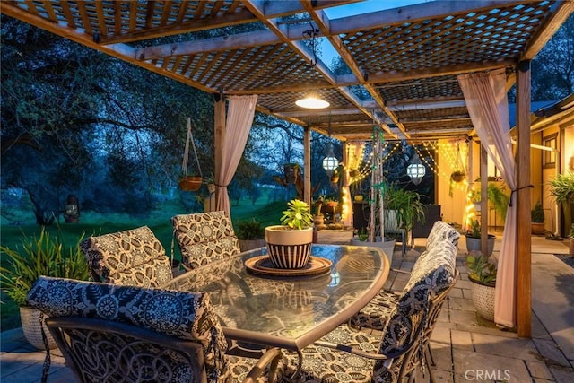 view of patio with outdoor dining space and a pergola