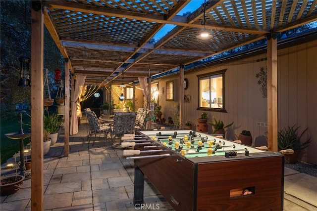 view of patio with outdoor dining area and a pergola