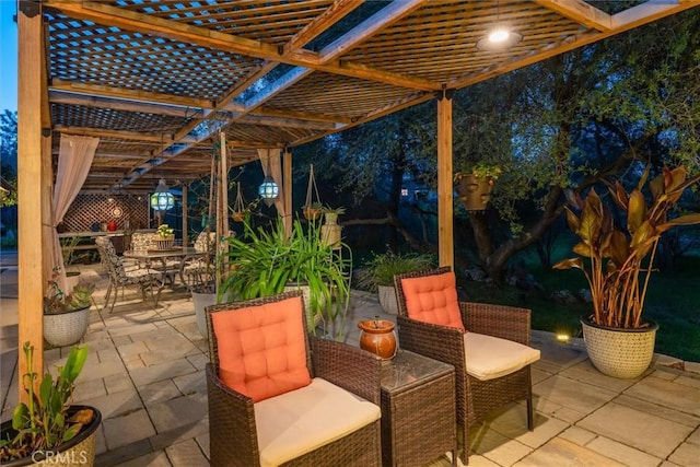 view of patio / terrace with outdoor dining space and a pergola