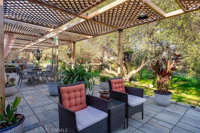 view of patio with a pergola and outdoor dining space