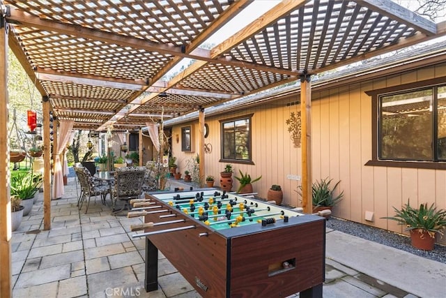 view of patio / terrace featuring outdoor dining space and a pergola