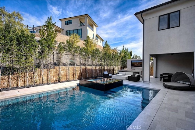 view of pool with a fenced in pool, a patio, fence, an in ground hot tub, and an outdoor living space