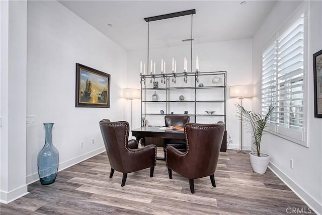 office area featuring baseboards and wood finished floors