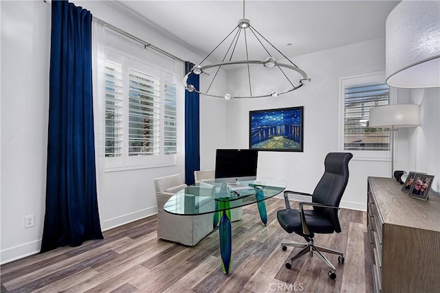 office featuring baseboards and wood finished floors