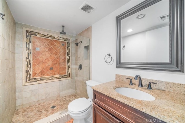 full bath featuring visible vents, a shower stall, and toilet