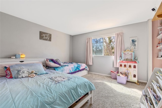 bedroom with carpet and baseboards