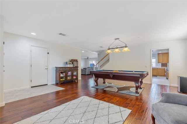 playroom with pool table, a healthy amount of sunlight, visible vents, and hardwood / wood-style flooring