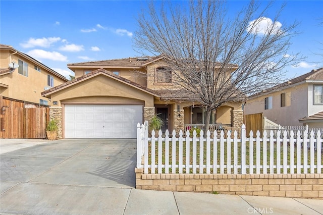 view of front of house featuring a garage, a fenced front yard, driveway, and stucco siding