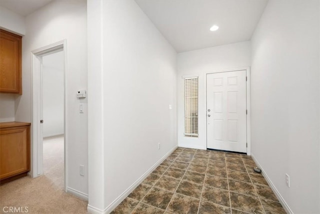 interior space with baseboards and recessed lighting