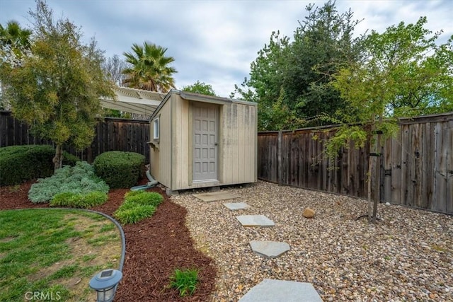 view of shed with a fenced backyard