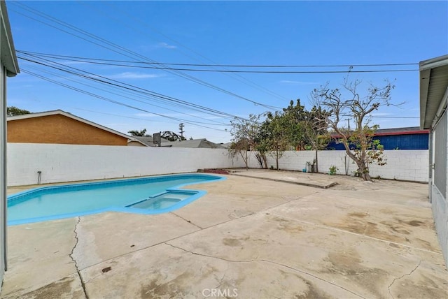 view of swimming pool featuring a patio area, a fenced backyard, and a fenced in pool