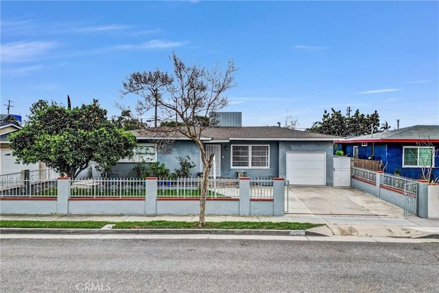 ranch-style house featuring an attached garage, a fenced front yard, concrete driveway, and stucco siding