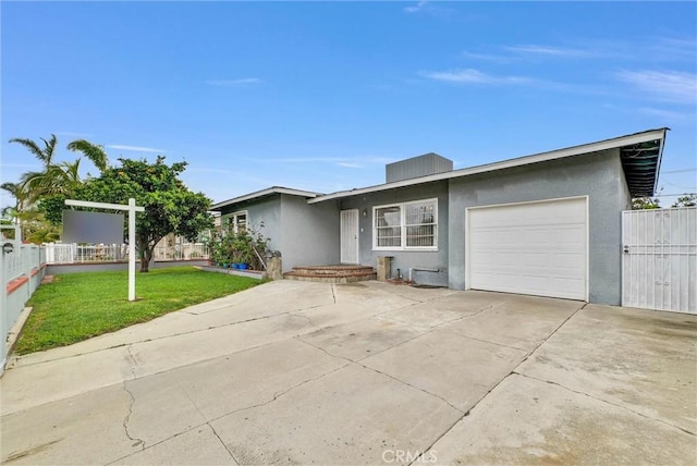 view of front of property with a garage, concrete driveway, fence, and stucco siding