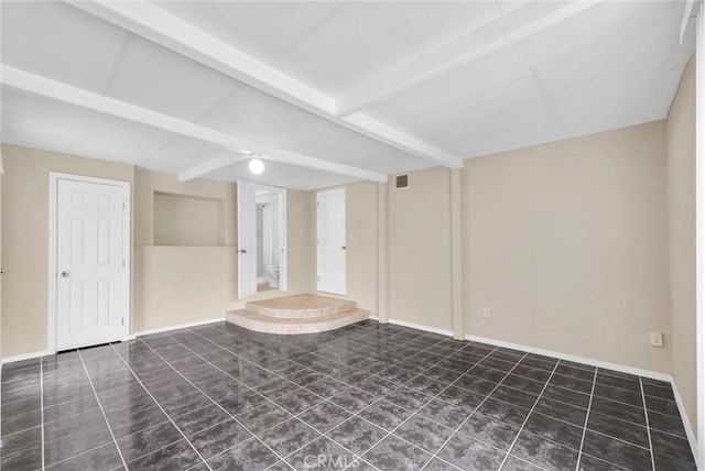 spare room featuring tile patterned flooring, baseboards, visible vents, and beamed ceiling