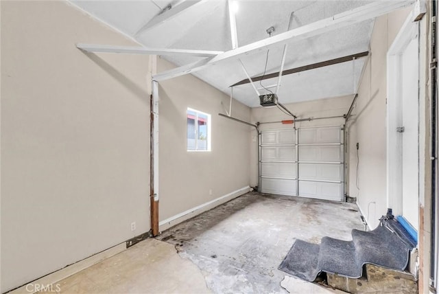 garage featuring baseboards and a garage door opener