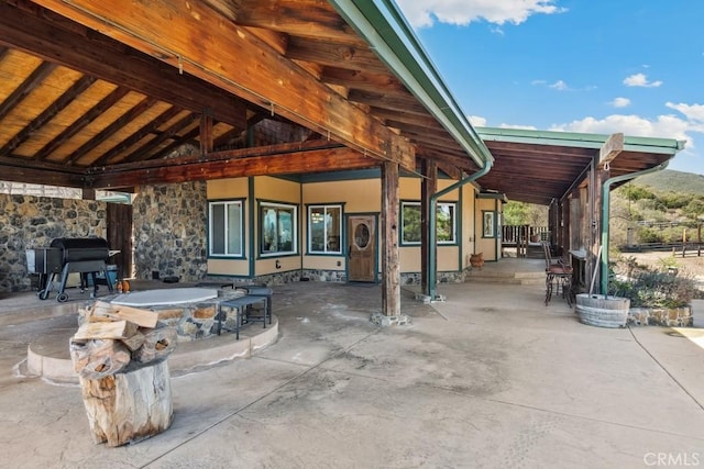 view of patio / terrace featuring outdoor dry bar and outdoor dining space