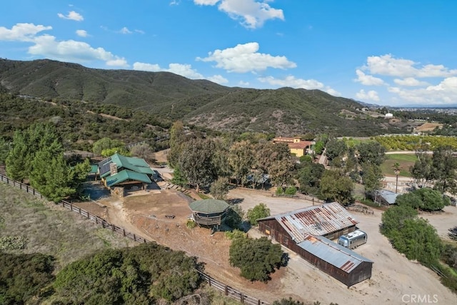 birds eye view of property with a mountain view