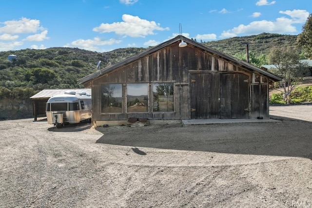 view of outdoor structure featuring a mountain view