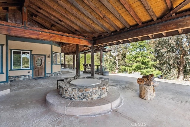 view of patio / terrace with an outdoor fire pit