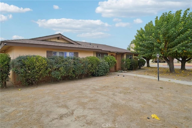 view of front of house featuring stucco siding