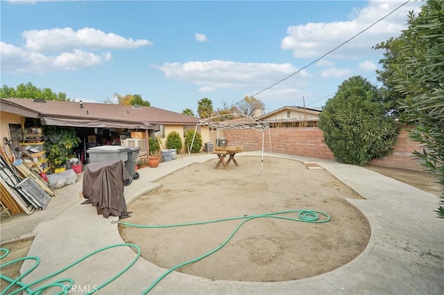 view of yard featuring a fenced backyard and a patio