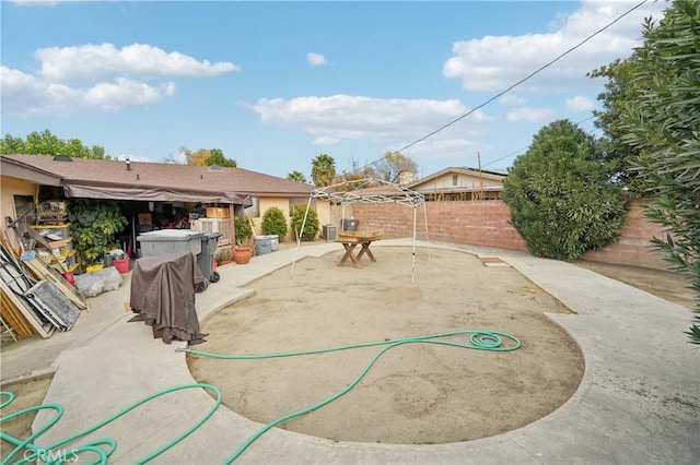 view of yard featuring a patio area and a fenced backyard