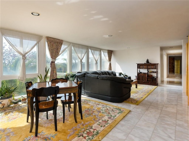 living room with light tile patterned flooring and recessed lighting