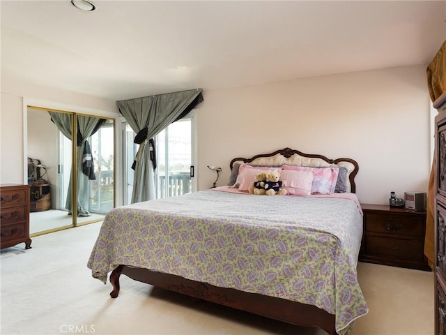 carpeted bedroom featuring access to exterior