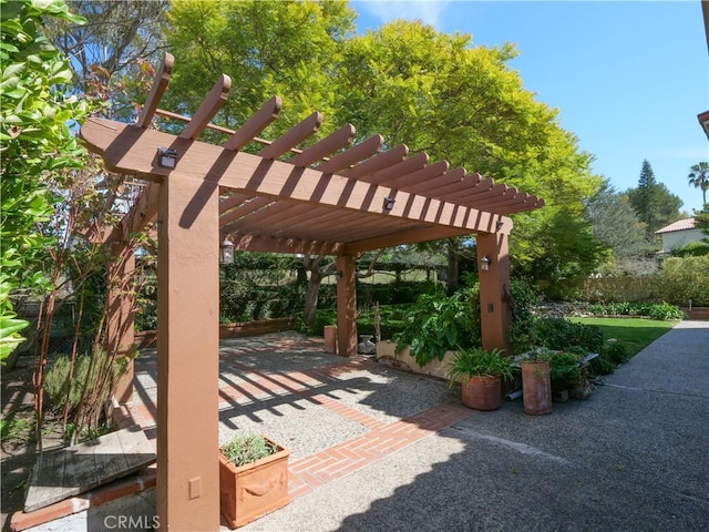 view of patio / terrace with fence and a pergola