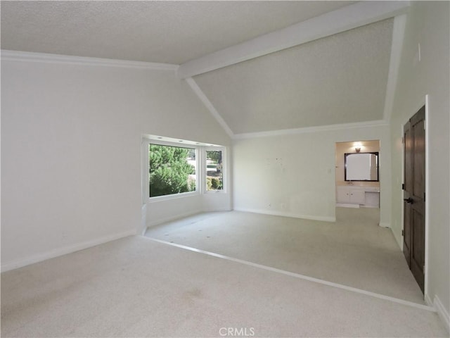 carpeted spare room with high vaulted ceiling, ornamental molding, beamed ceiling, and baseboards