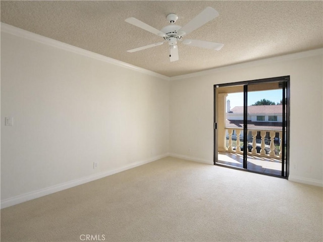 empty room featuring baseboards, ceiling fan, ornamental molding, a textured ceiling, and carpet floors