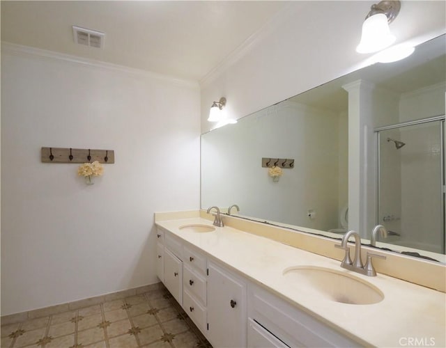 full bathroom with toilet, ornamental molding, a sink, and visible vents