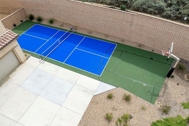 view of tennis court with fence